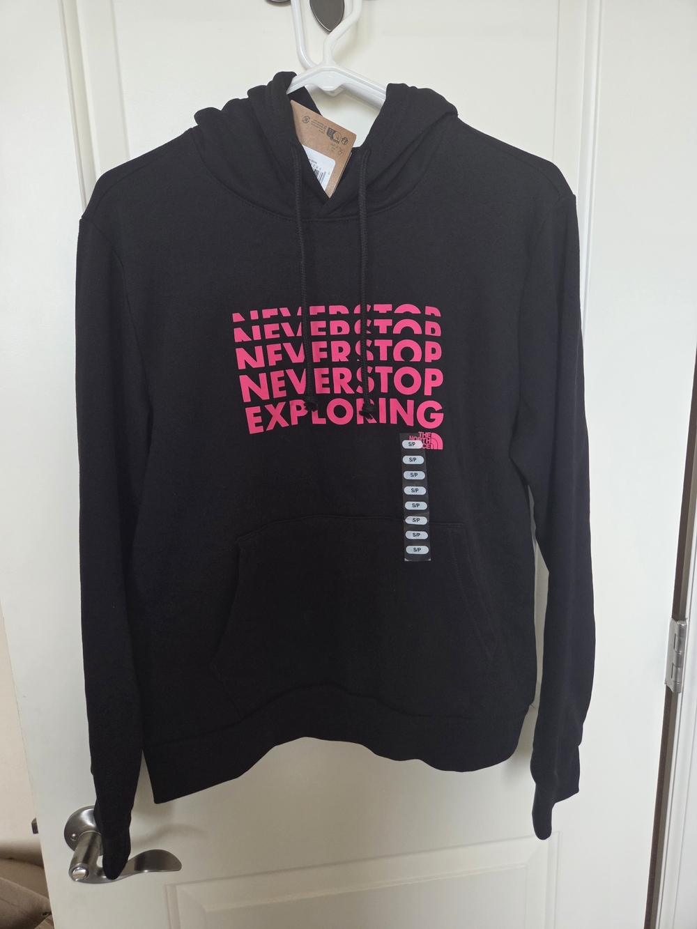 The North Face Black Hoodie with Pink 'Never Stop Exploring' Graphic
